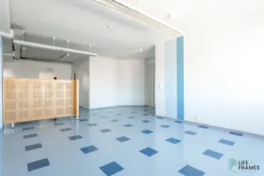 Lauttakylänkatu 4 in Huittinen basic office space with blue vinyl tile flooring.