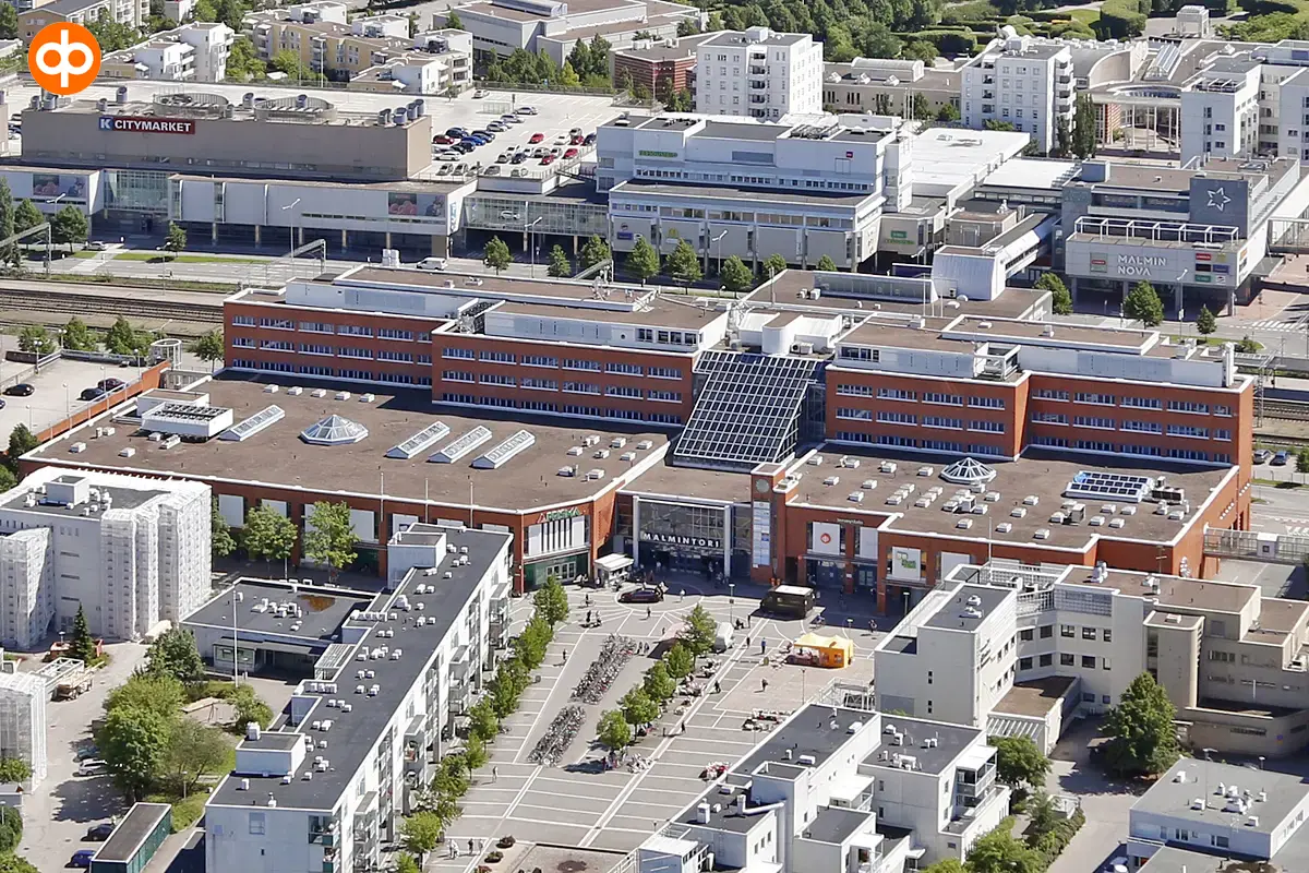 Aereal photoAerial photo of Malmintori shopping centre. A rail line runs behind the building.