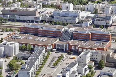 Aereal photoAerial photo of Malmintori shopping centre. A rail line runs behind the building.